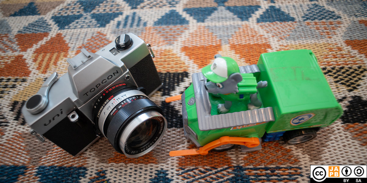 Topcon UV Topcor 35 mm f/3.5 lens on Topcon Uni camera with paw patrol toy.